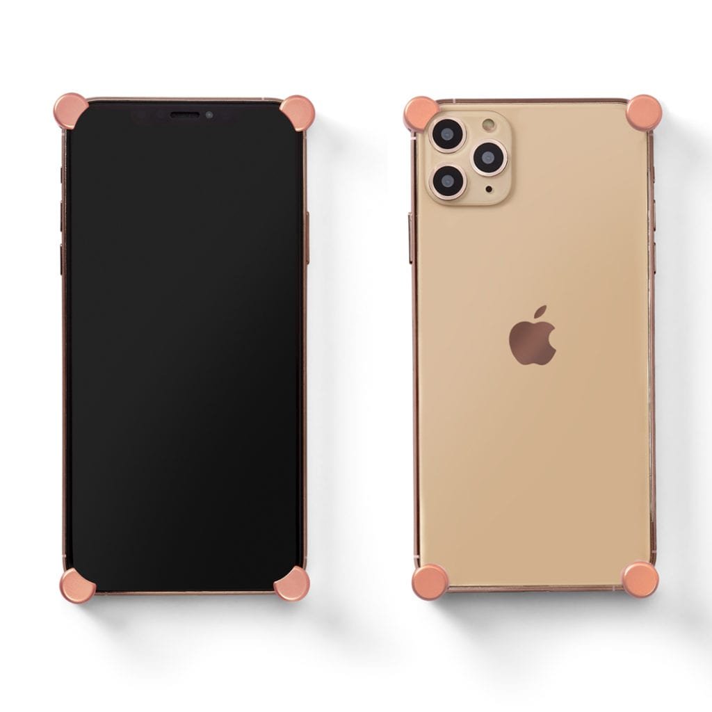 Rose Gold Original CORNERS installed on all four corners of a bare iPhone 11