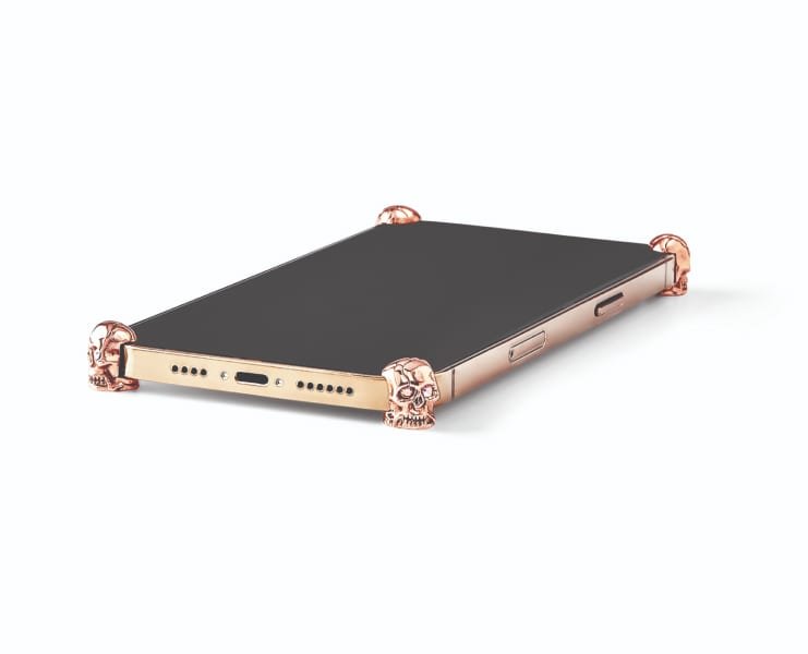 Rose Gold Skull ICONS installed on all four corners of a bare iPhone 12 / 12 Pro / Max / mini