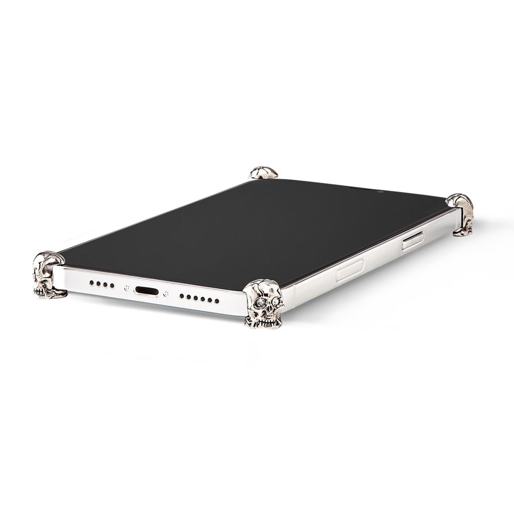 Silver Skull ICONS installed on all four corners of a bare iPhone 13 / 13 Pro / 13 Pro Max