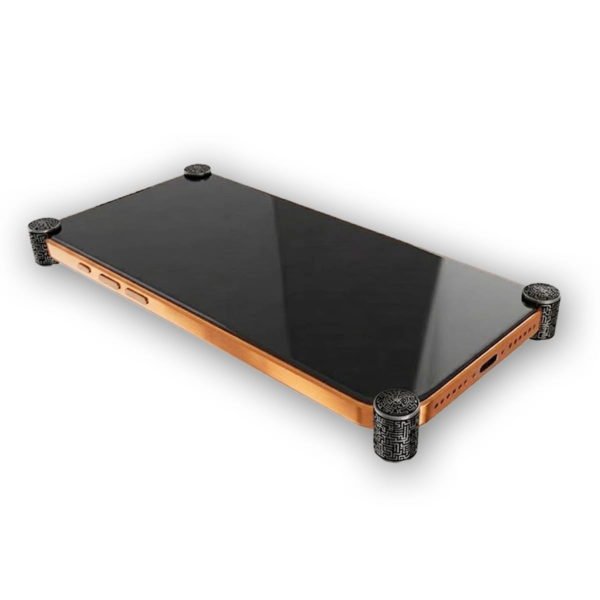 Carbon Matrix ICONS installed on all four corners of a bare iPhone 17 Pro / Max