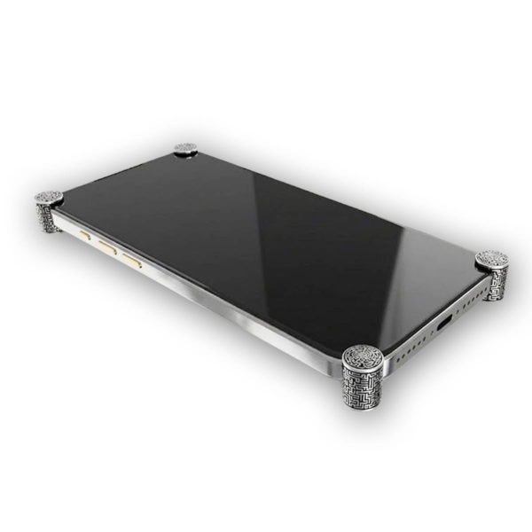 Silver Matrix ICONS installed on all four corners of a bare iPhone 17