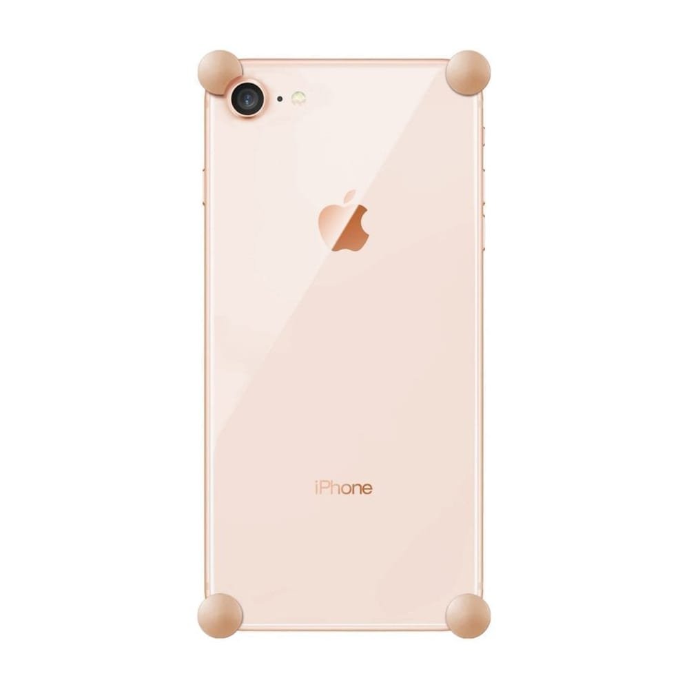 Rose Gold Original CORNERS installed on all four corners of a bare iPhone SE (2nd gen)