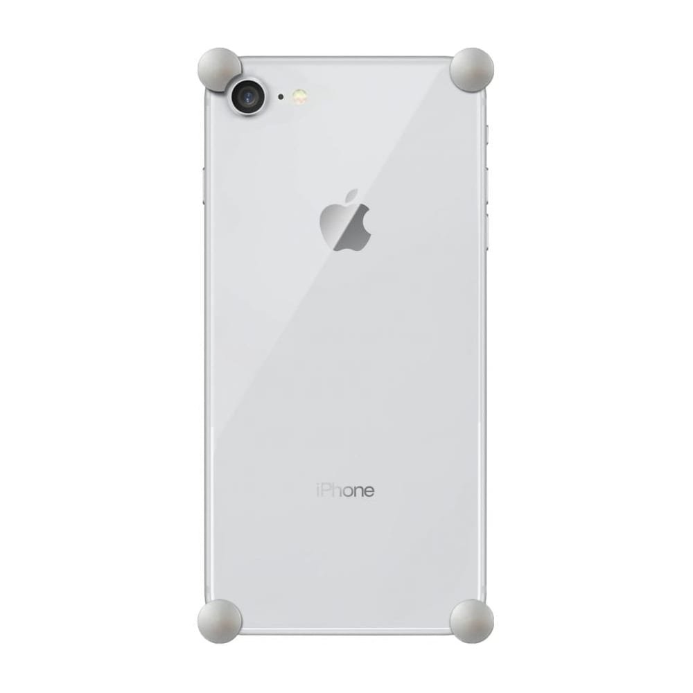 Satin Silver Original CORNERS installed on all four corners of a bare iPhone SE (2nd gen)