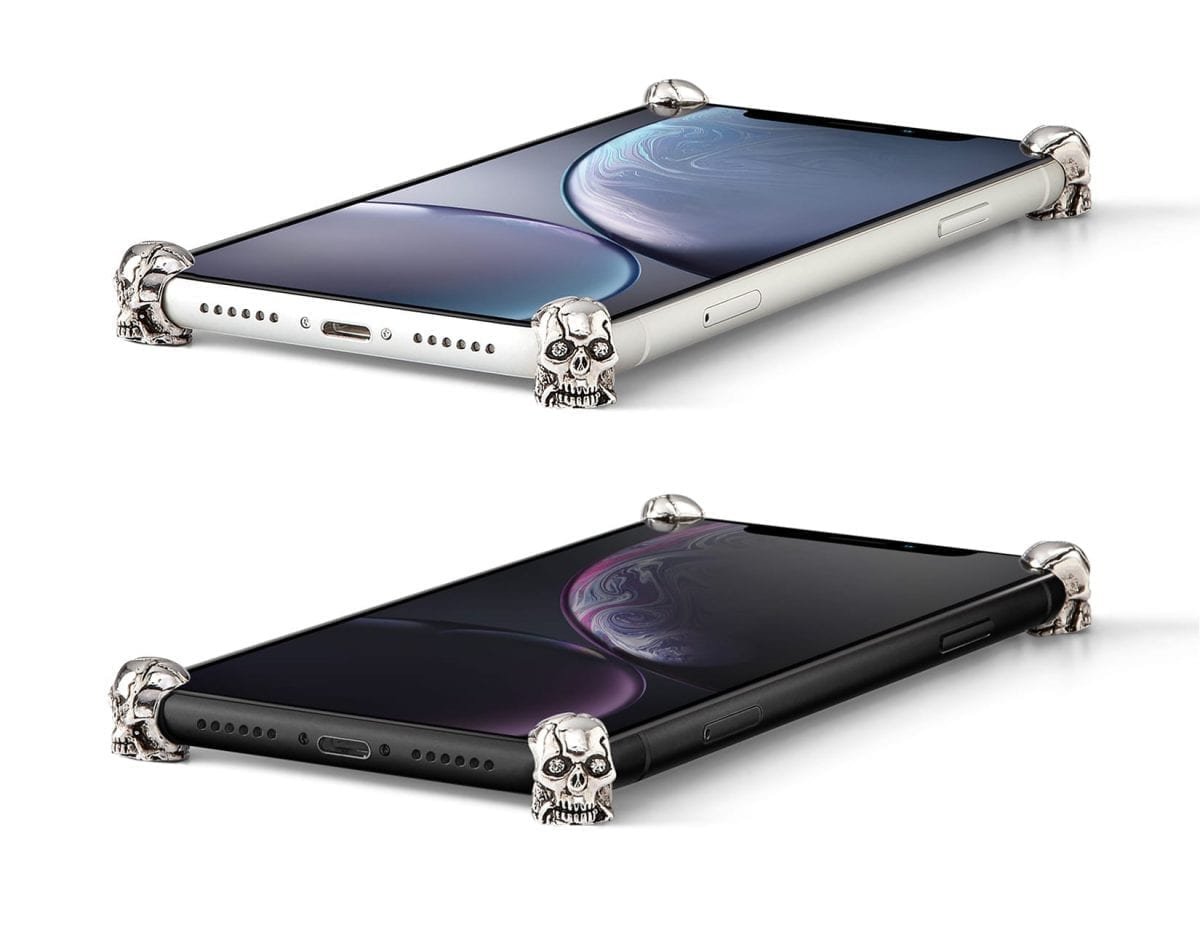 Silver Skull ICONS installed on all four corners of a bare iPhone XR